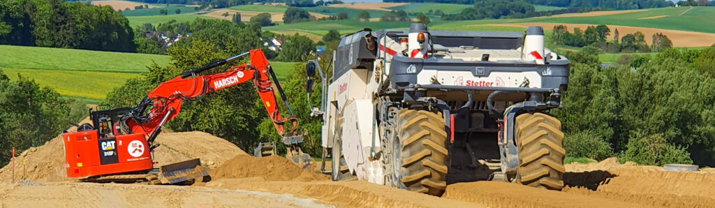 Erd‑ und Tiefbauarbeiten mit schweren Baumaschinen zur Untergrundvorbereitung